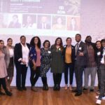 Picture of Equitable Opportunities Now team at 2022 Celebration of Equity Champions at Black Market in Roxbury. Image includes: - EON Lead Trainer Laury Lucien, - EON Programming Co-Chair Eve Marie Santana, - Cannabis Control Commissioner Nurys Camargo, - Rep. Chynah Tyler, - EON Co-Founder Shanel Lindsay, - Director of Business Strategy for the Mayor's Office of Economic Opportunity and Inclusion Alia Hamada Forrest, - EON Co-Founder and former Commissioner Shanel Lindsay, - Former Sen. Sonia Chang Diaz, - BECMA Policy and Advocacy Lead Darien Johnson, - EON Policy Co-Chair Armani Whitr - EON Media Director Ian Powell